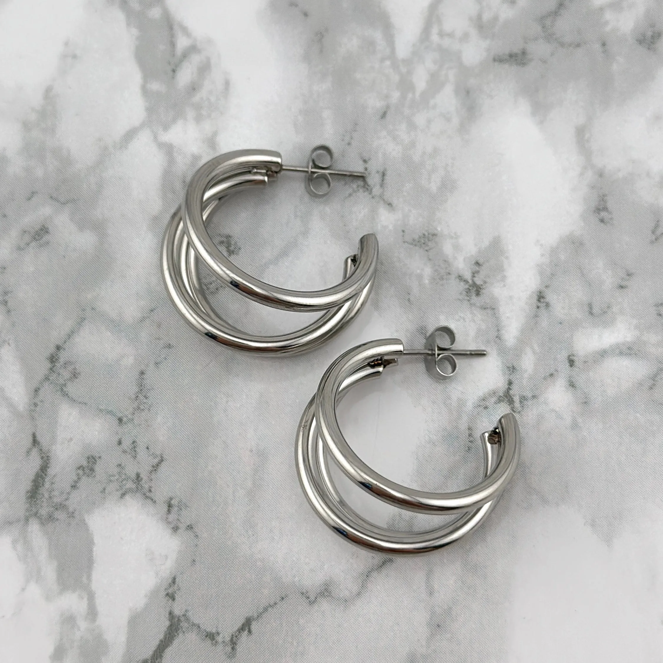 Silver triple hoops